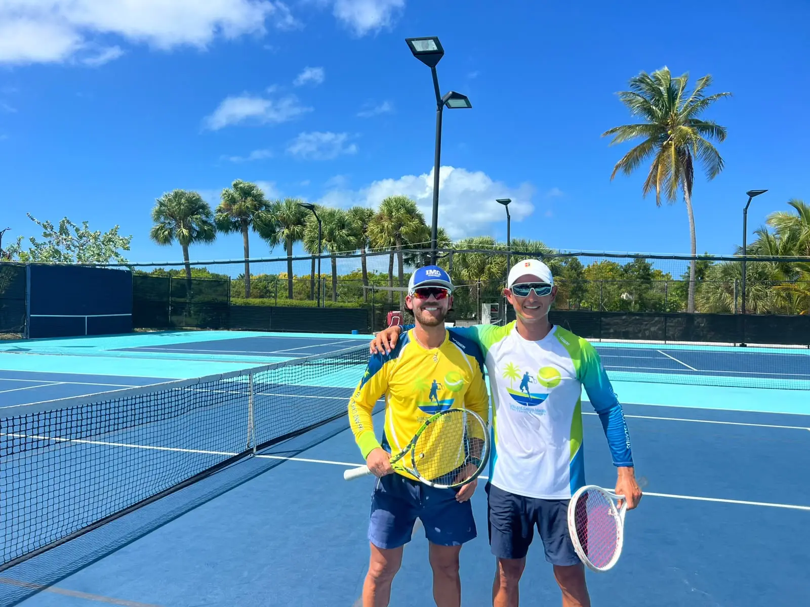 Rey Rivera and Jhon on court in the academy's jerseys