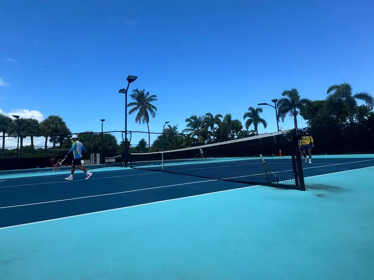 Tennis court with palm trees at the Royal Turks and Caicos Golf Club